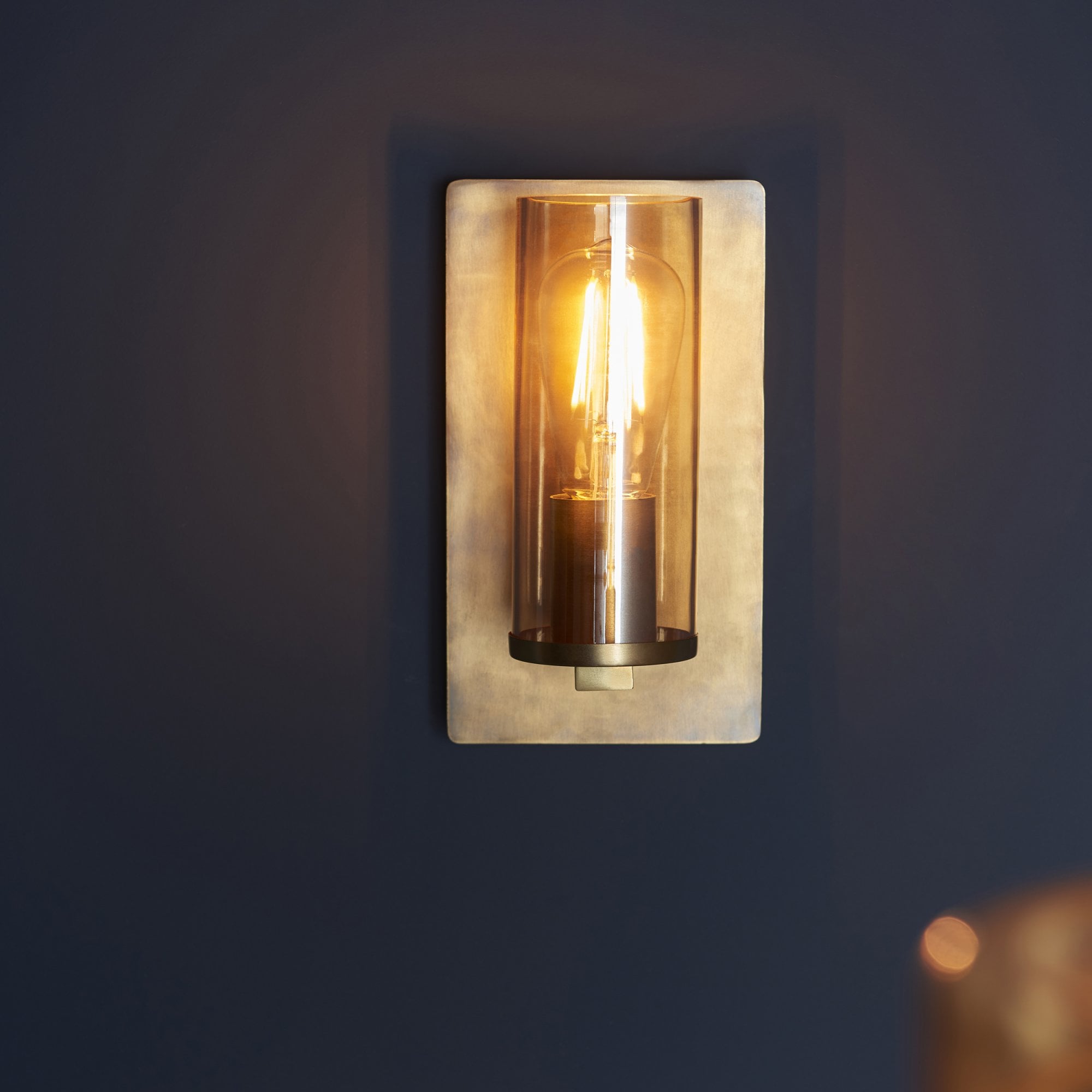 Utopia Swirl Wall Light - Brass Patina With Champagne Tinted Glass