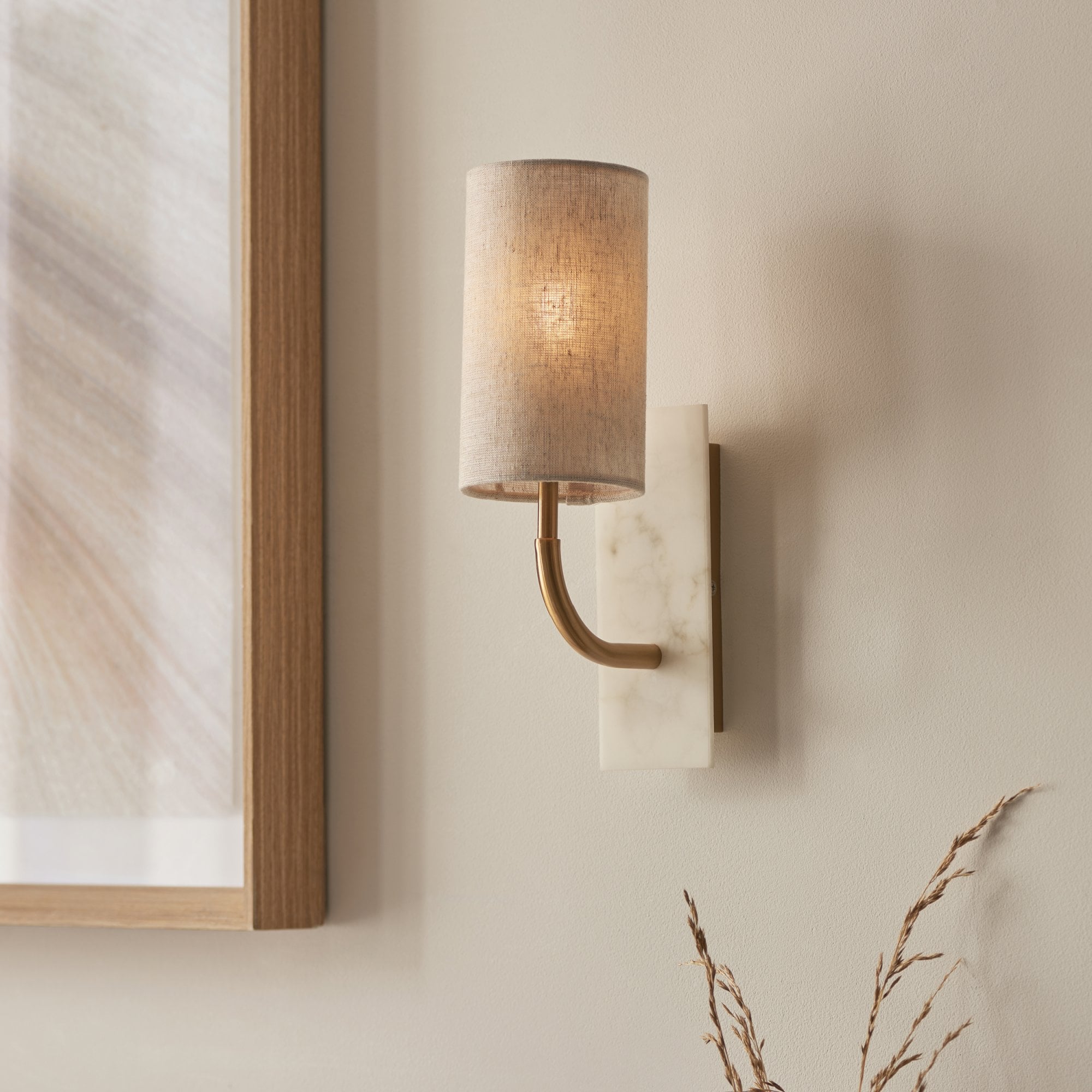 Utopia Spire Single White Marble Curved Arm Wall Light - Vintage Brass & Natural Cylindrical Shade