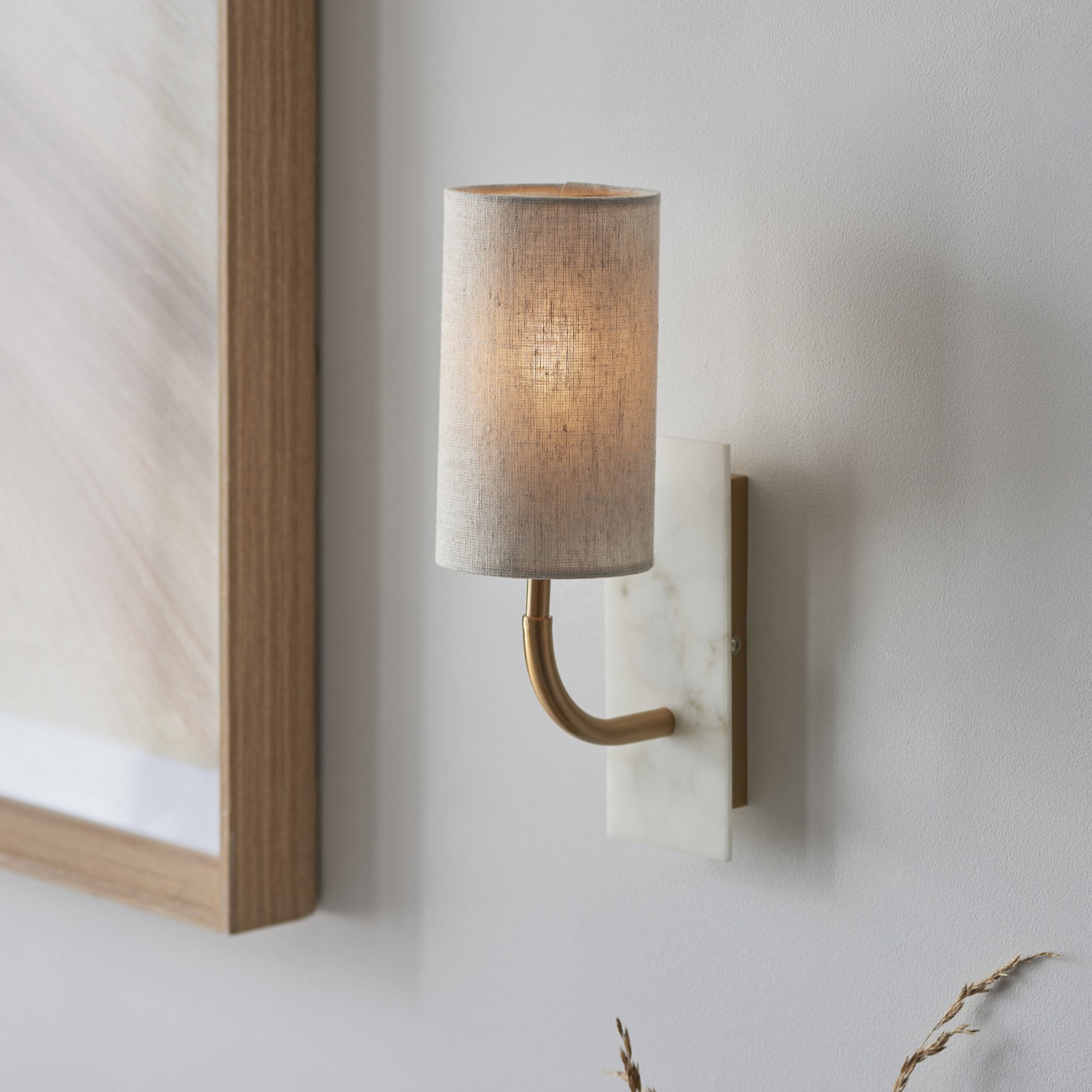 Utopia Spire Single White Marble Curved Arm Wall Light - Vintage Brass & Natural Cylindrical Shade