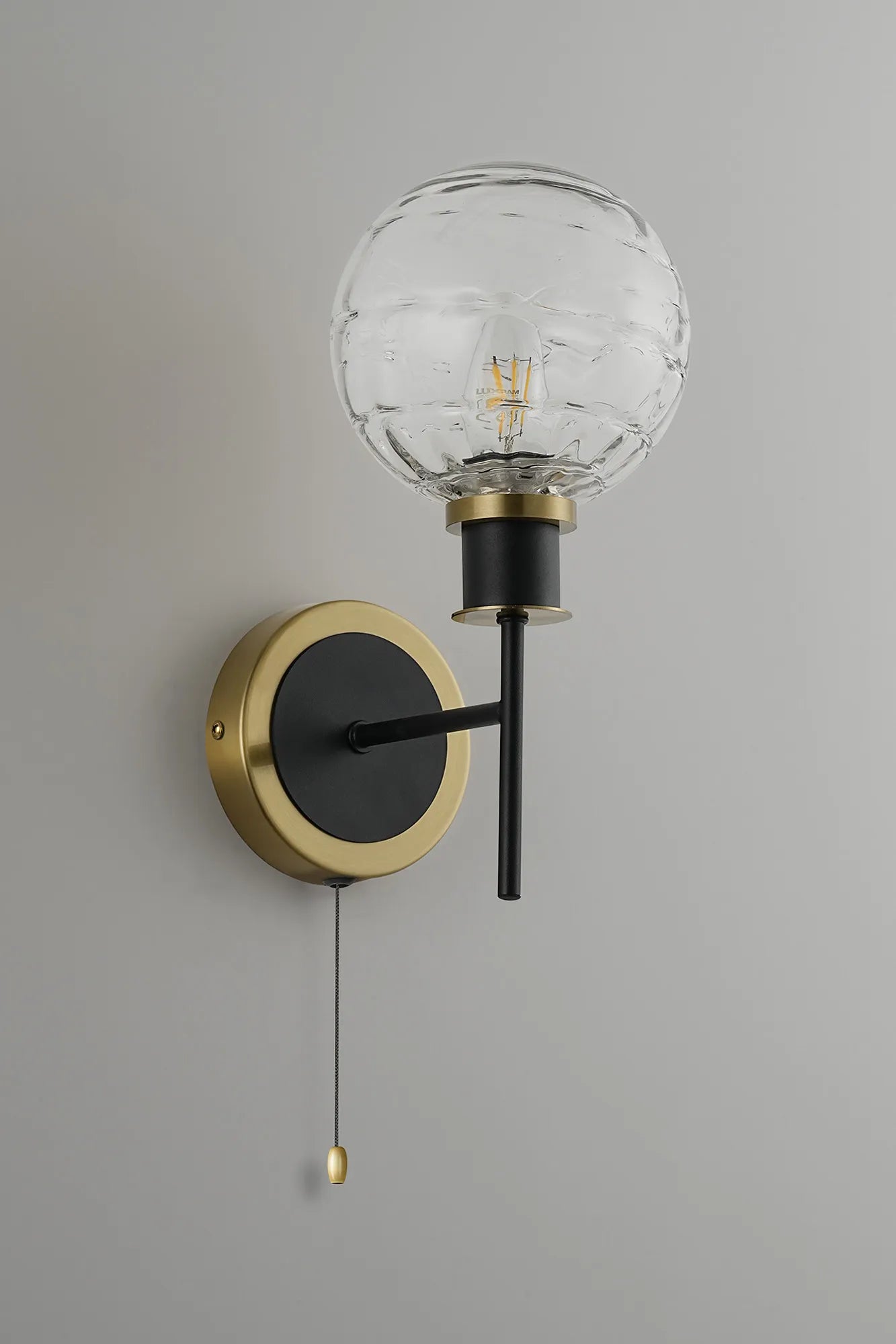 Sycamore Switched Wall Light with 15cm Round Textured Melting Glass Shade - Brass, Clear & Satin Black