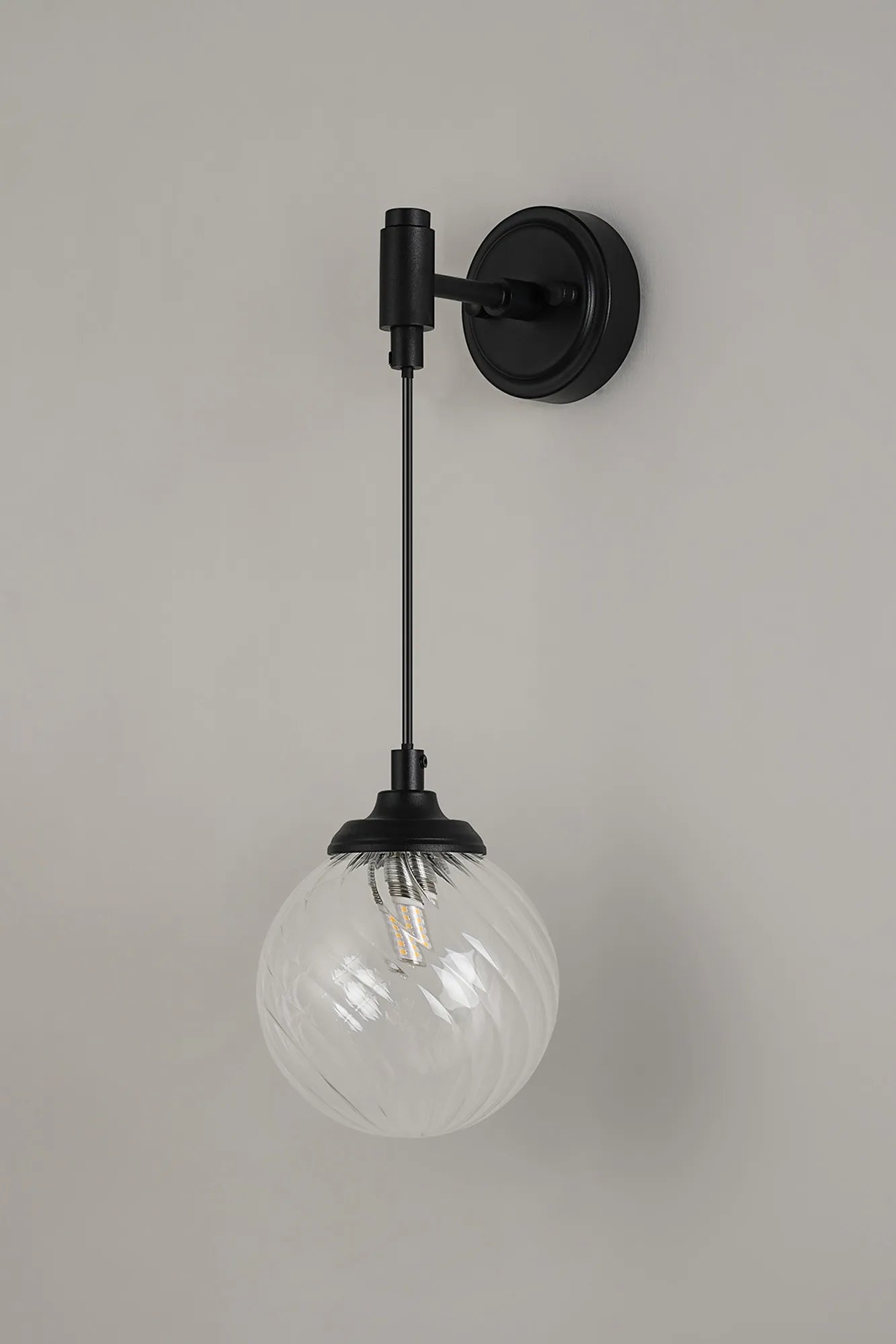 Dene Adjustable Single Wall Light IP44 - Satin Black & Clear Swirl Round Glass