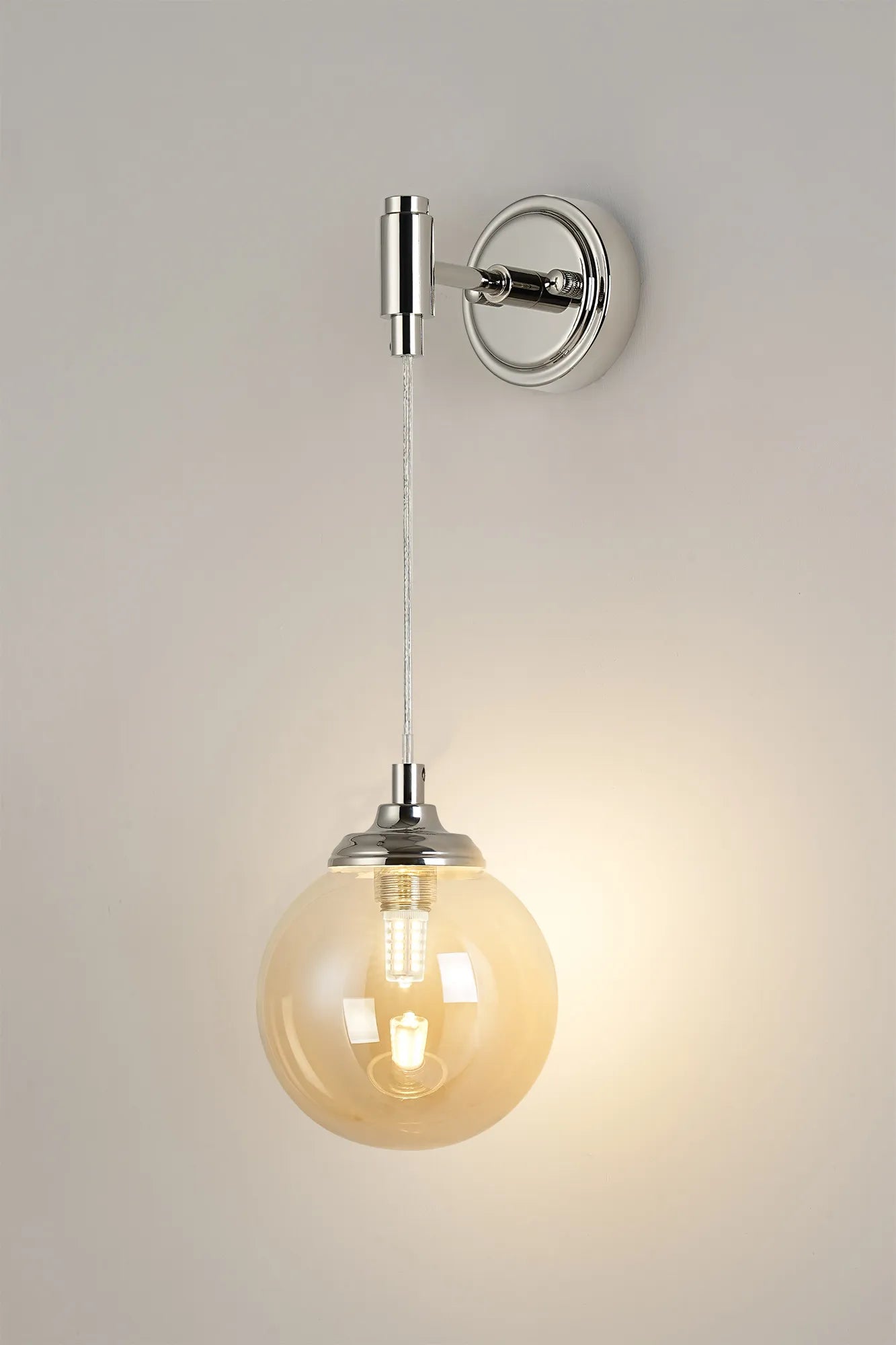Dene Adjustable Single Wall Light IP44 - Polished Nickel & Amber Smooth Round Glass