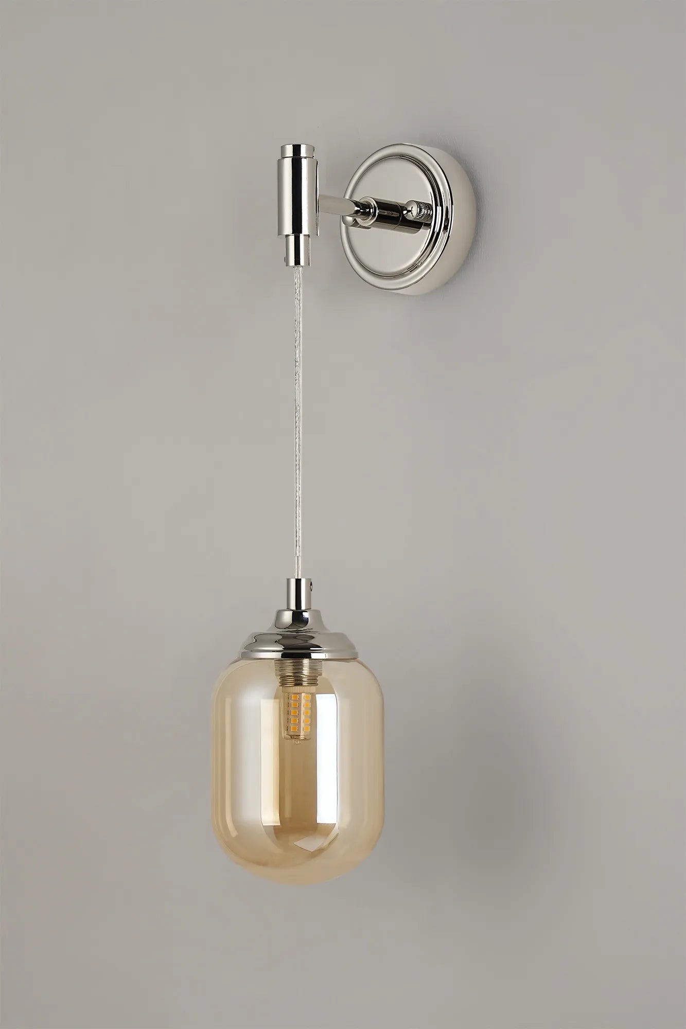 Dene Adjustable Single Wall Light IP44 - Polished Nickel & Amber Smooth Tubular Glass
