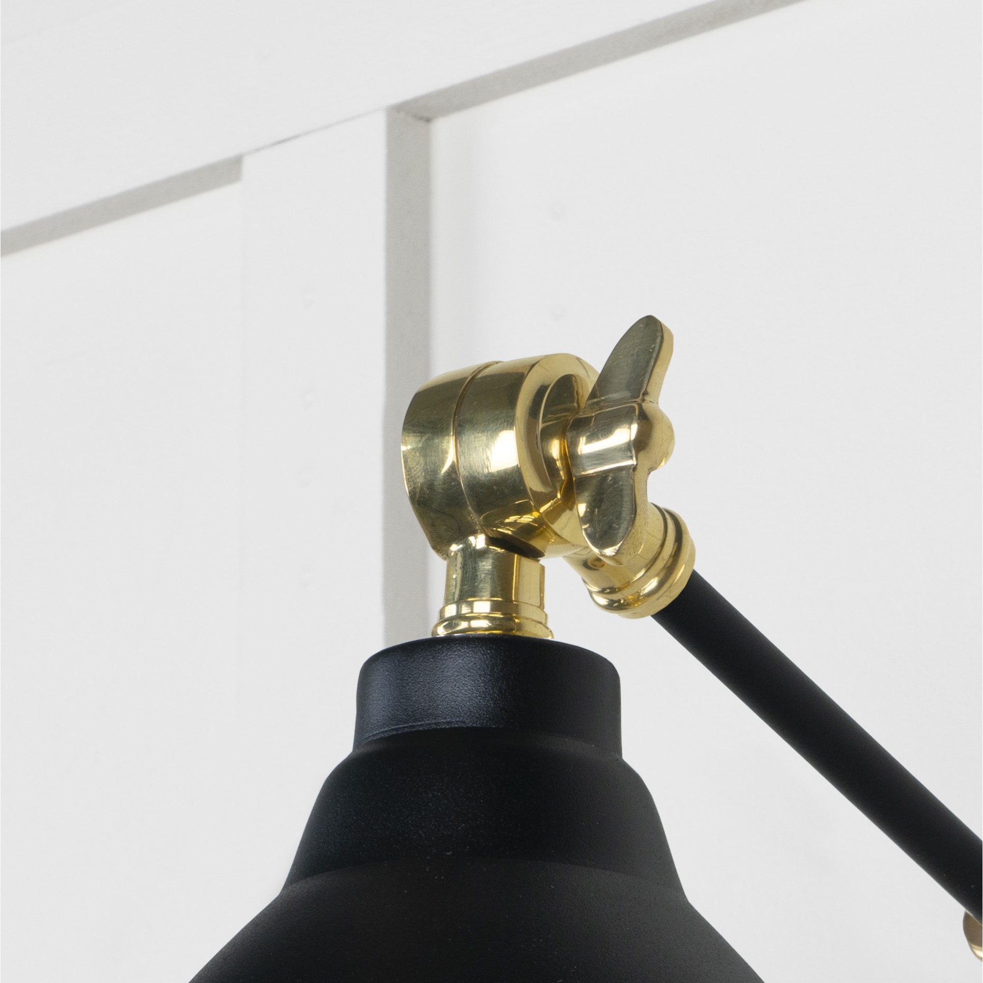 From The Anvil Hammered Brass Brindley Wall Light - Elan Black