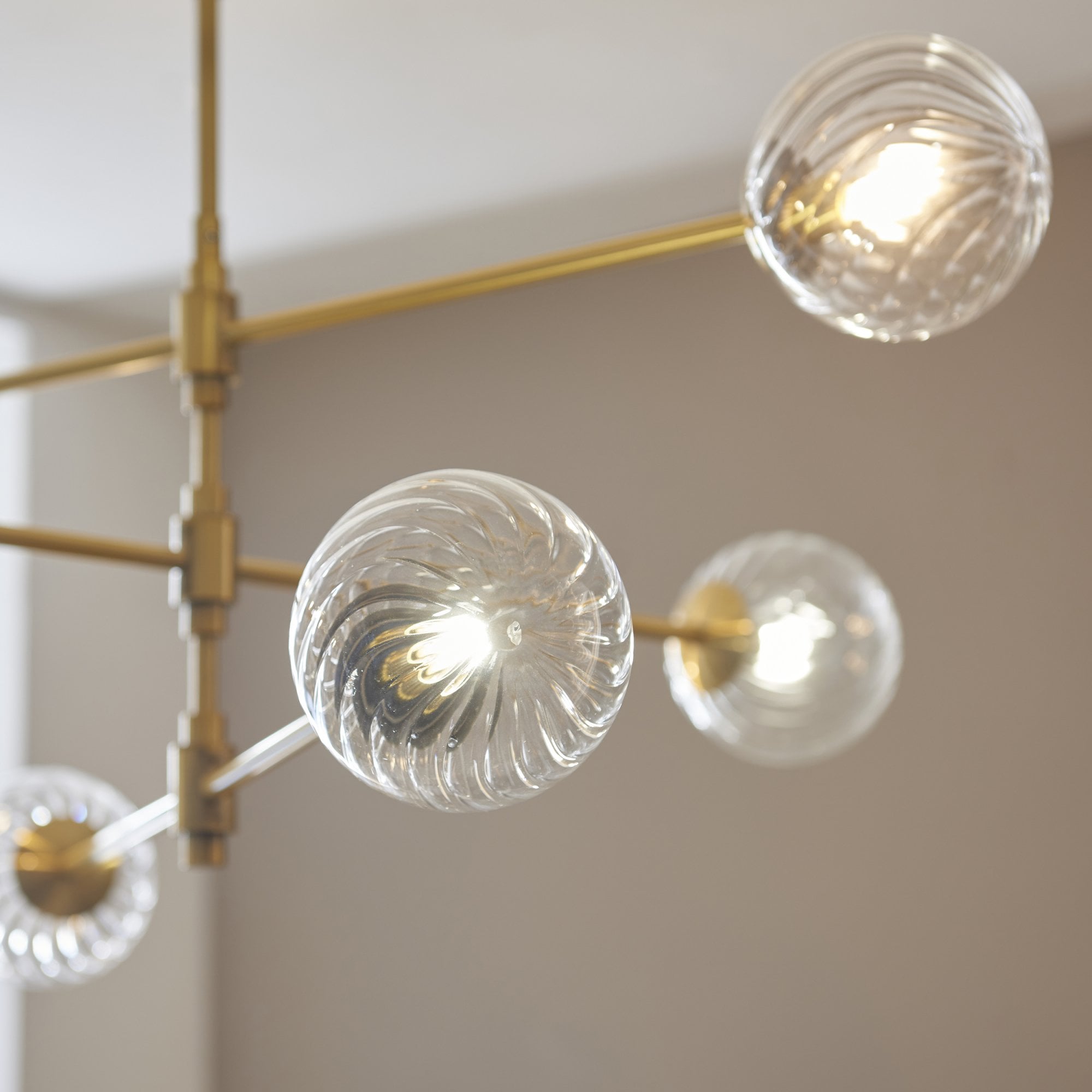 Utopia Atomic 6 Light Pendant - Brushed Aged Brass & Twisted Clear Glass