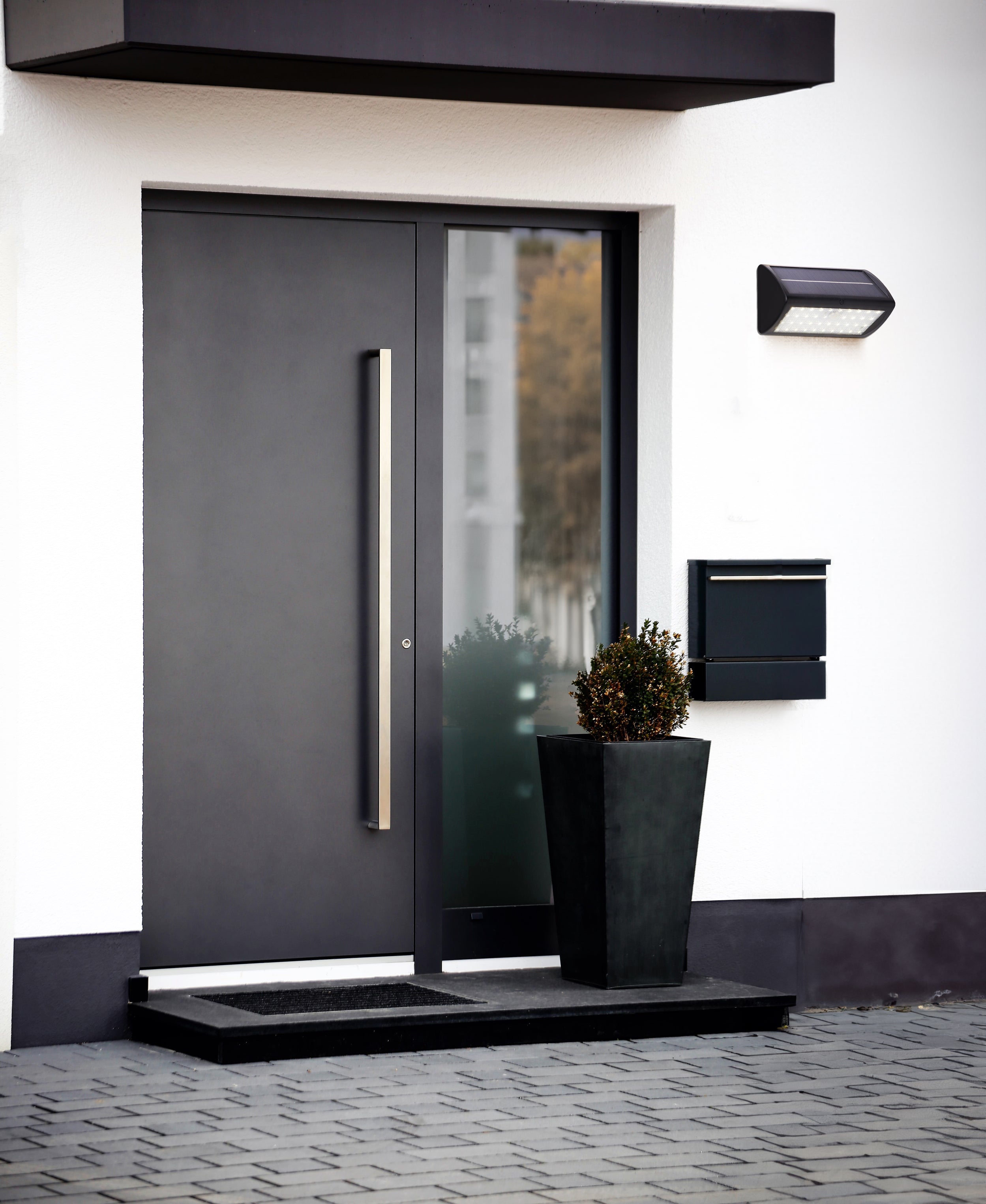 Searchlight Cairo Solar Outdoor Wall Light with PIR - Black & White Polycarbonate