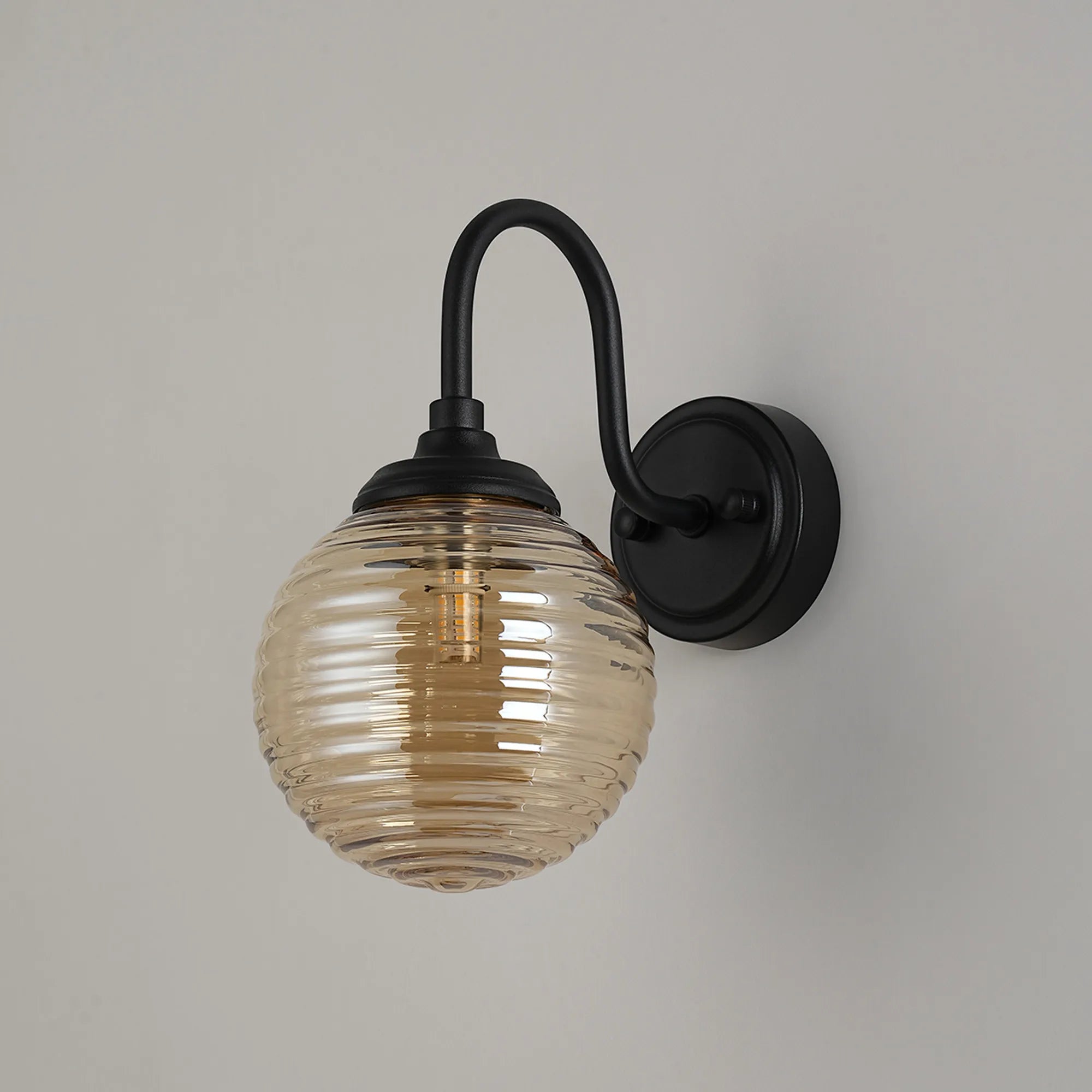 Dene Curved Arm Wall Light - 1 Light - IP44 Satin Black & Amber Ribbed Round Glass