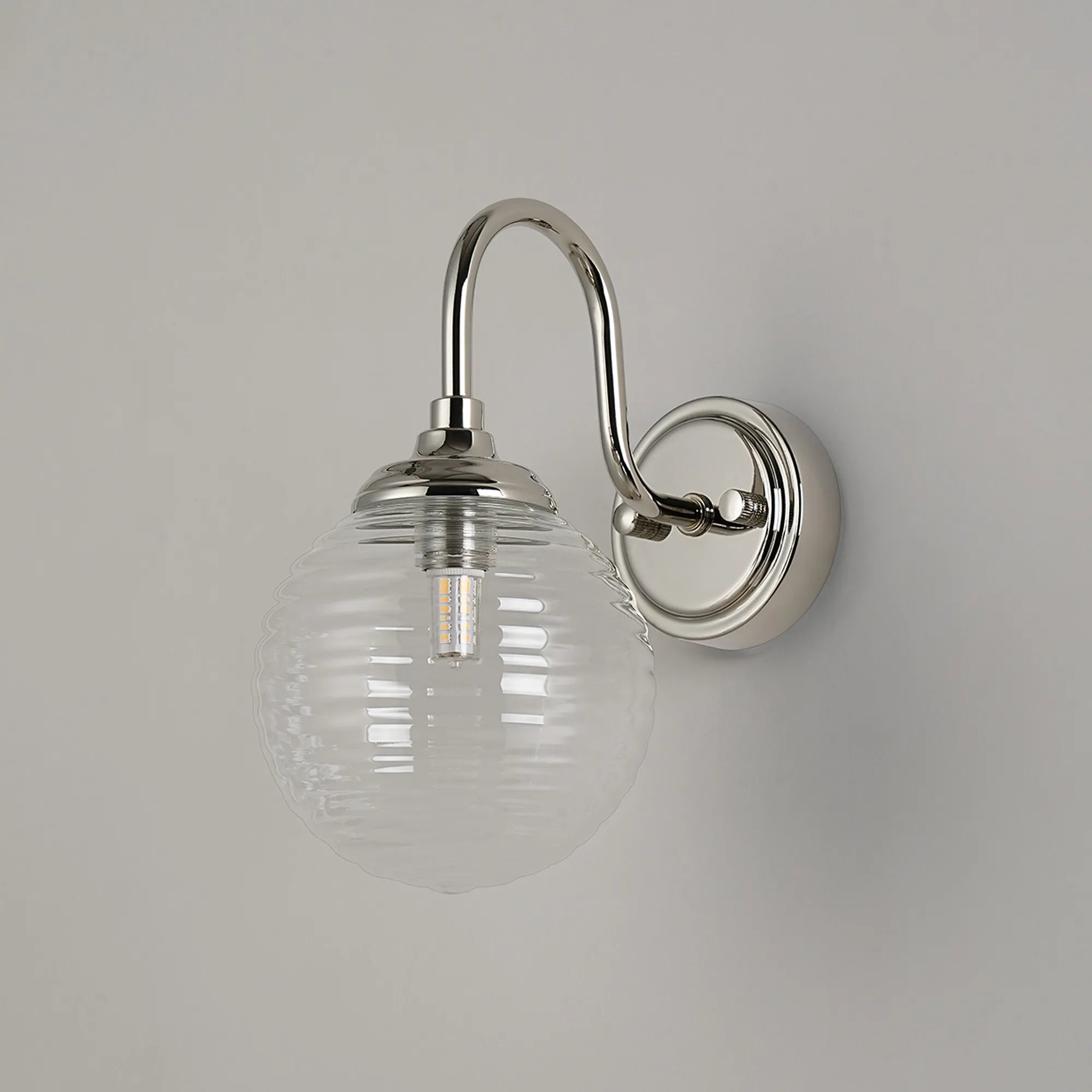 Dene Curved Arm Wall Light - 1 Light - IP44 Polished Nickel & Clear Ribbed Round Glass