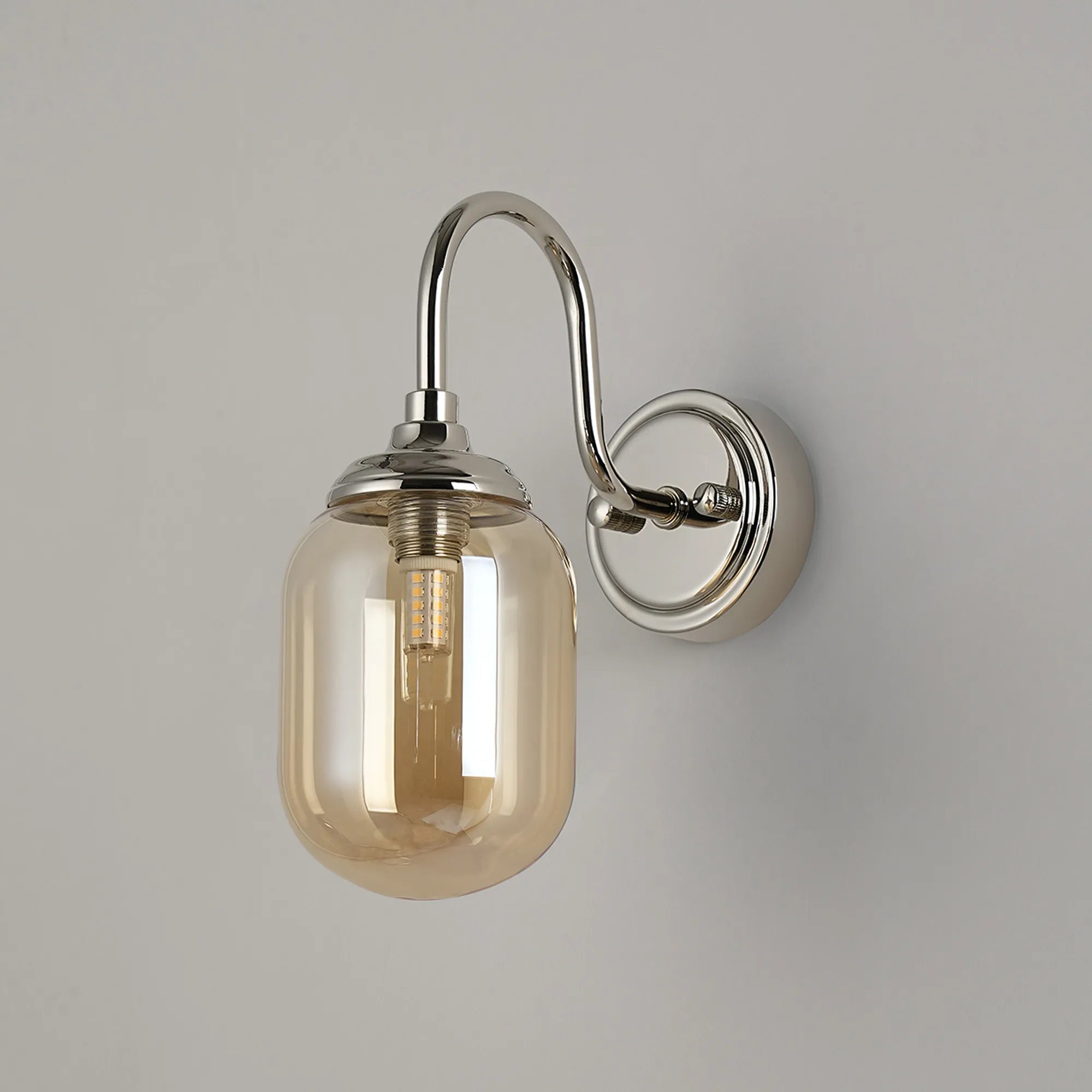 Dene Curved Arm Wall Light - 1 Light - IP44 Polished Nickel & Amber Smooth Tubular Glass