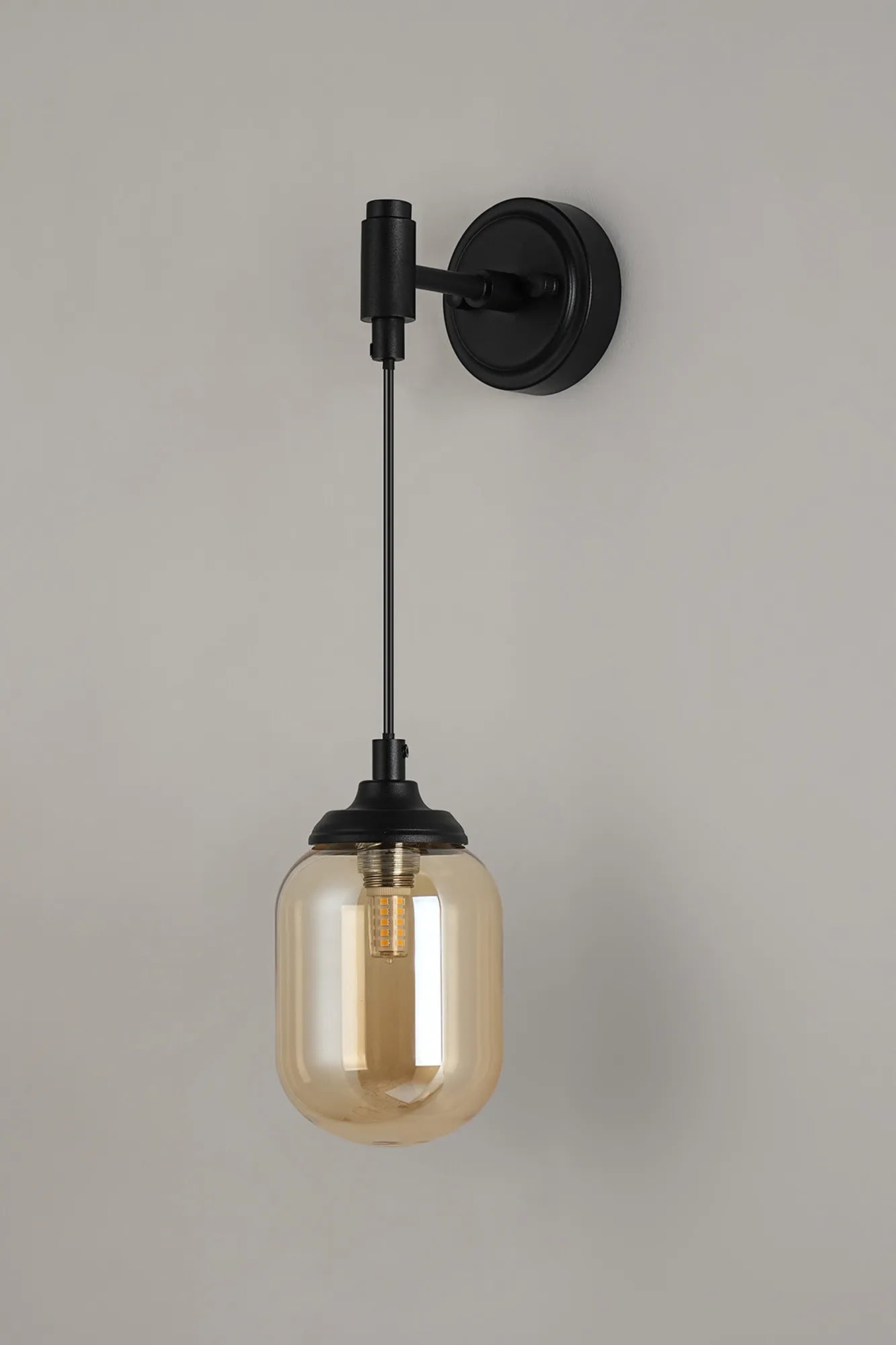 Dene Adjustable Single Wall Light IP44 - Satin Black & Amber Smooth Tubular Glass
