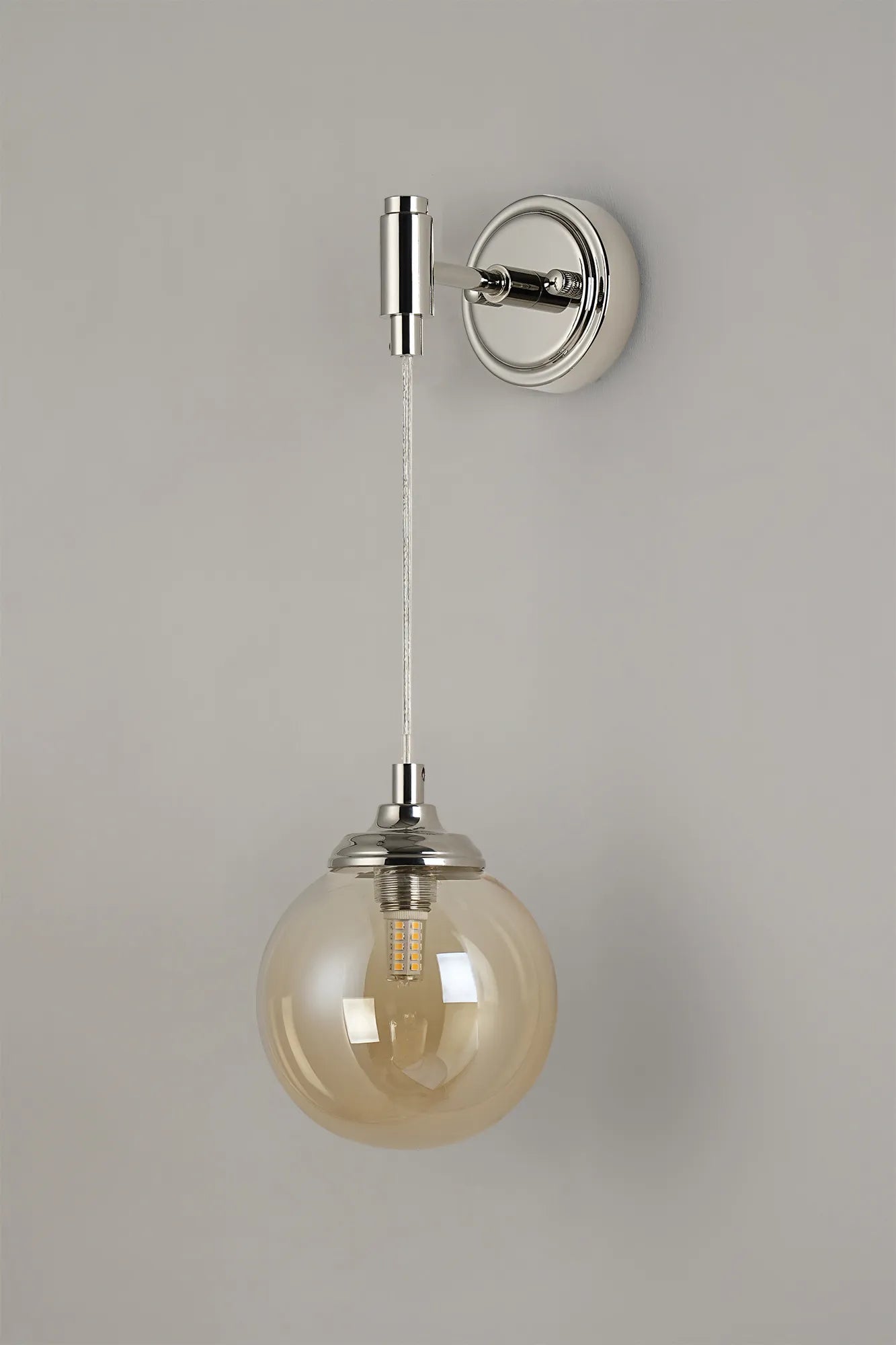 Dene Adjustable Single Wall Light IP44 - Polished Nickel & Amber Smooth Round Glass