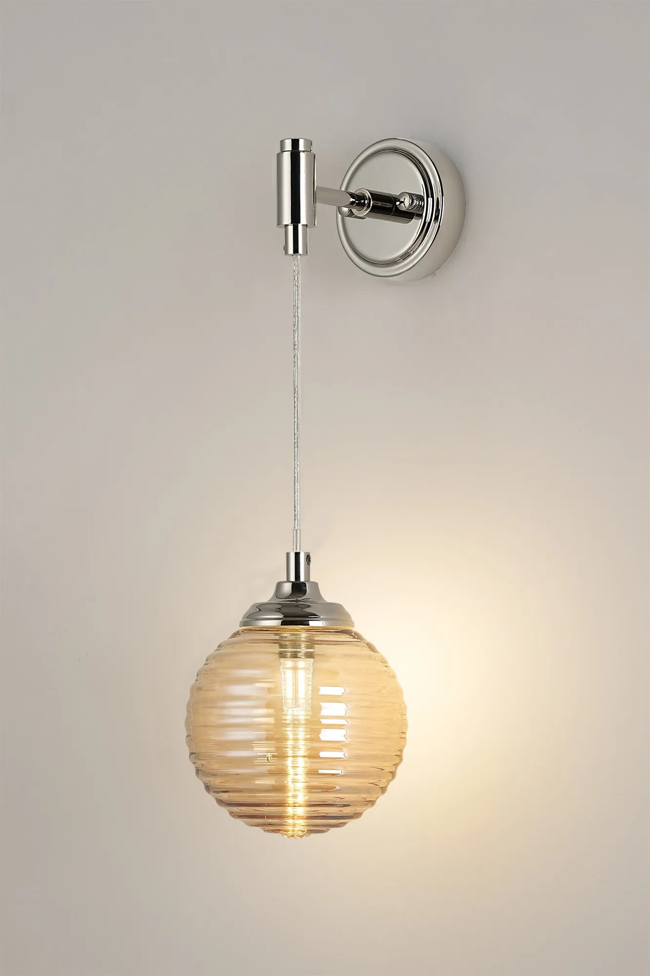 Dene Adjustable Single Wall Light IP44 - Polished Nickel & Amber Ribbed Round Glass